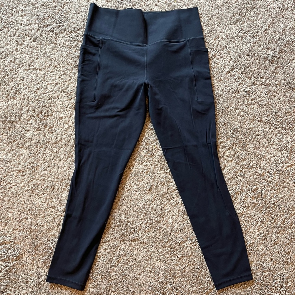 Athleta Salutation Stash Tight in navy